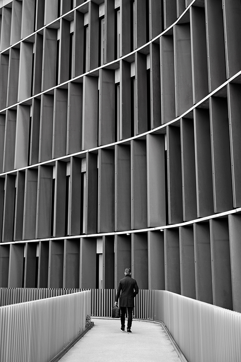 A man walking up the incline of the Panum building in Copenhagen