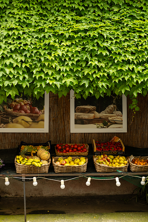 Fruits in baskets outside a greengrocer's shop