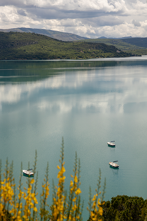 Three boats floating on Lac de Sainte-Croix