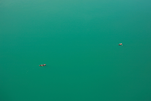 Two boats floating on Lake Bled in Slovenia