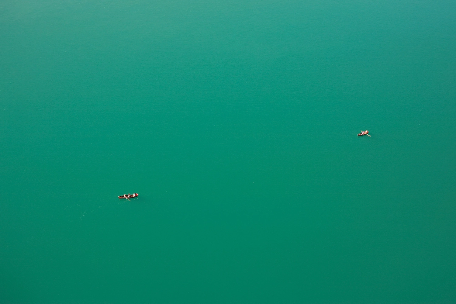 Two boats floating on Lake Bled in Slovenia